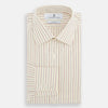 View 4 of product The Turnbull & Asser Pink Double Stripe Mayfair Shirt features long sleeves, a pointed T&A collar, and buttoned cuffs, crafted from organic cotton with pink double stripes on white, shown laid flat against a light background.