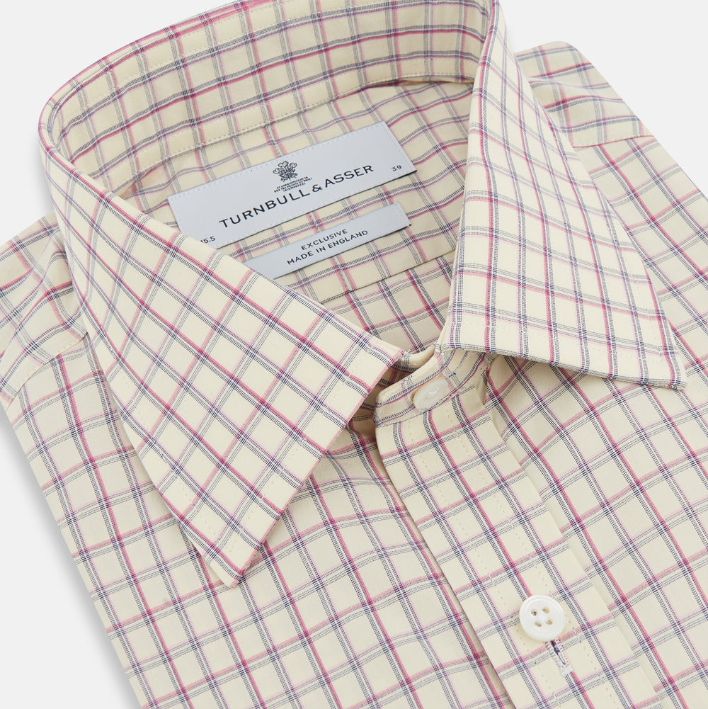 The Turnbull & Asser Pink Multi Check Mayfair Shirt features a T&A collar, long sleeves, and a pink check pattern on white organic cotton, shown against a plain white background.