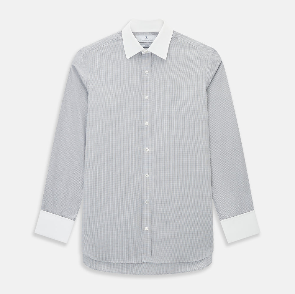 A Chequered White on Navy Regular Fit Shirt in Cotton by Turnbull & Asser UK, featuring a light gray finely checked pattern with a contrasting white collar and white French cuffs, long sleeves, buttoned up and displayed against a white background.