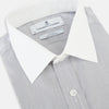 View 2 of product A Chequered White on Navy Regular Fit Shirt in Cotton by Turnbull & Asser UK, featuring a light gray finely checked pattern with a contrasting white collar and white French cuffs, long sleeves, buttoned up and displayed against a white background.