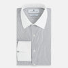 View 5 of product A Chequered White on Navy Regular Fit Shirt in Cotton by Turnbull & Asser UK, featuring a light gray finely checked pattern with a contrasting white collar and white French cuffs, long sleeves, buttoned up and displayed against a white background.