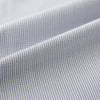 View 6 of product A Chequered White on Navy Regular Fit Shirt in Cotton by Turnbull & Asser UK, featuring a light gray finely checked pattern with a contrasting white collar and white French cuffs, long sleeves, buttoned up and displayed against a white background.