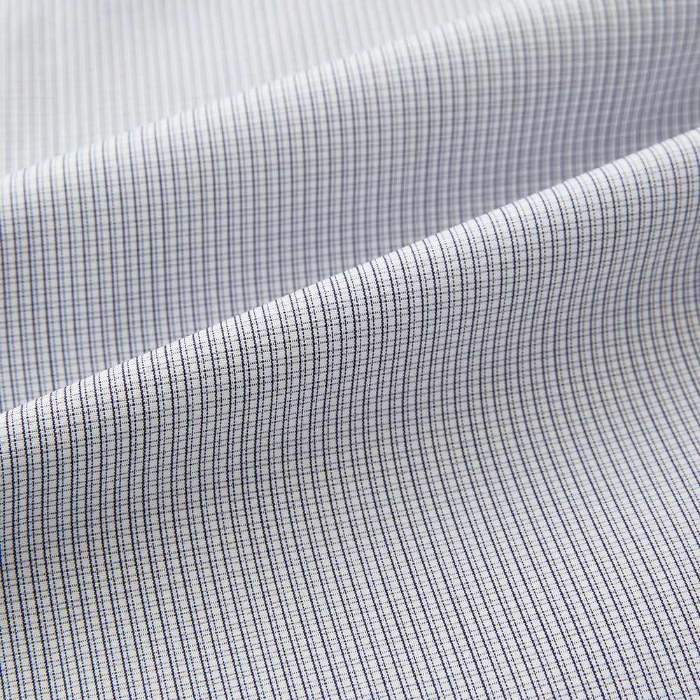 A Chequered White on Navy Regular Fit Shirt in Cotton by Turnbull & Asser UK, featuring a light gray finely checked pattern with a contrasting white collar and white French cuffs, long sleeves, buttoned up and displayed against a white background.