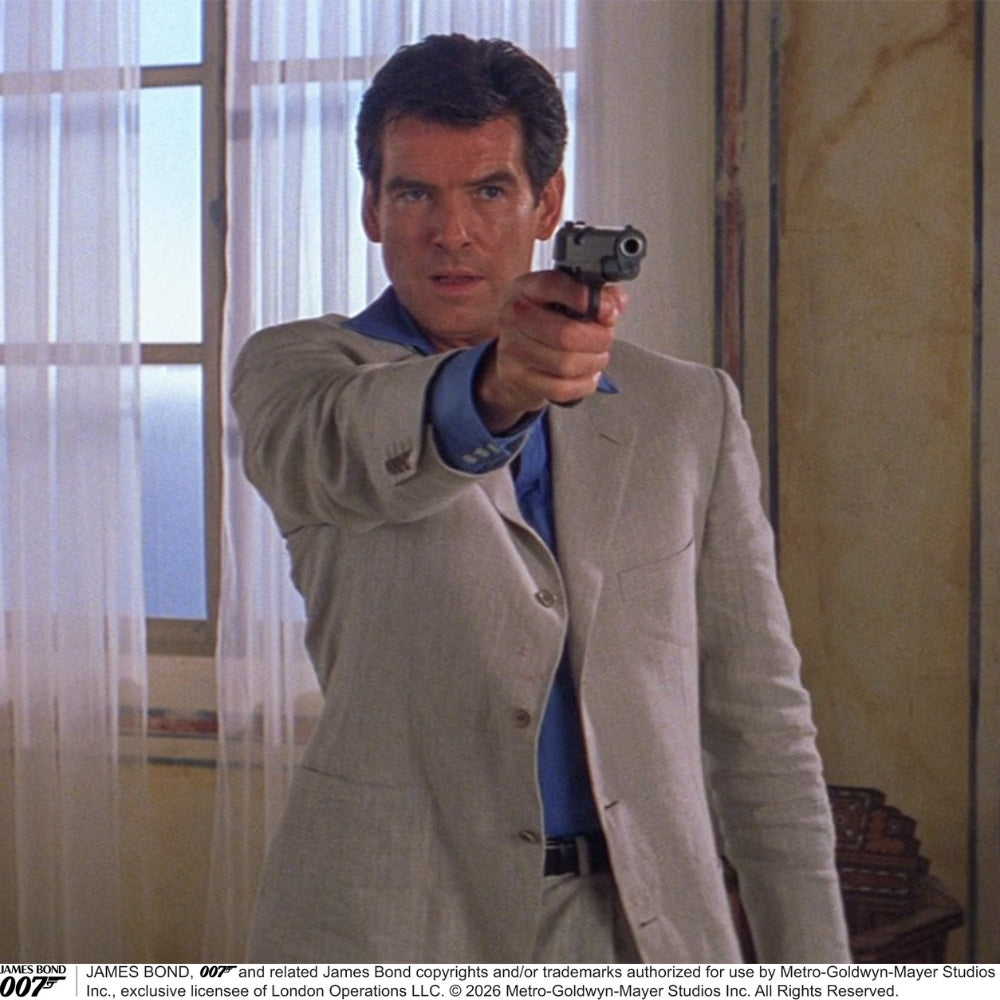The World Is Not Enough Blue Cotton Istanbul Shirt by Turnbull & Asser, as seen on James Bond, features long sleeves, white buttons, a classic collar, and buttoned cuffs, shown against a plain white background.
