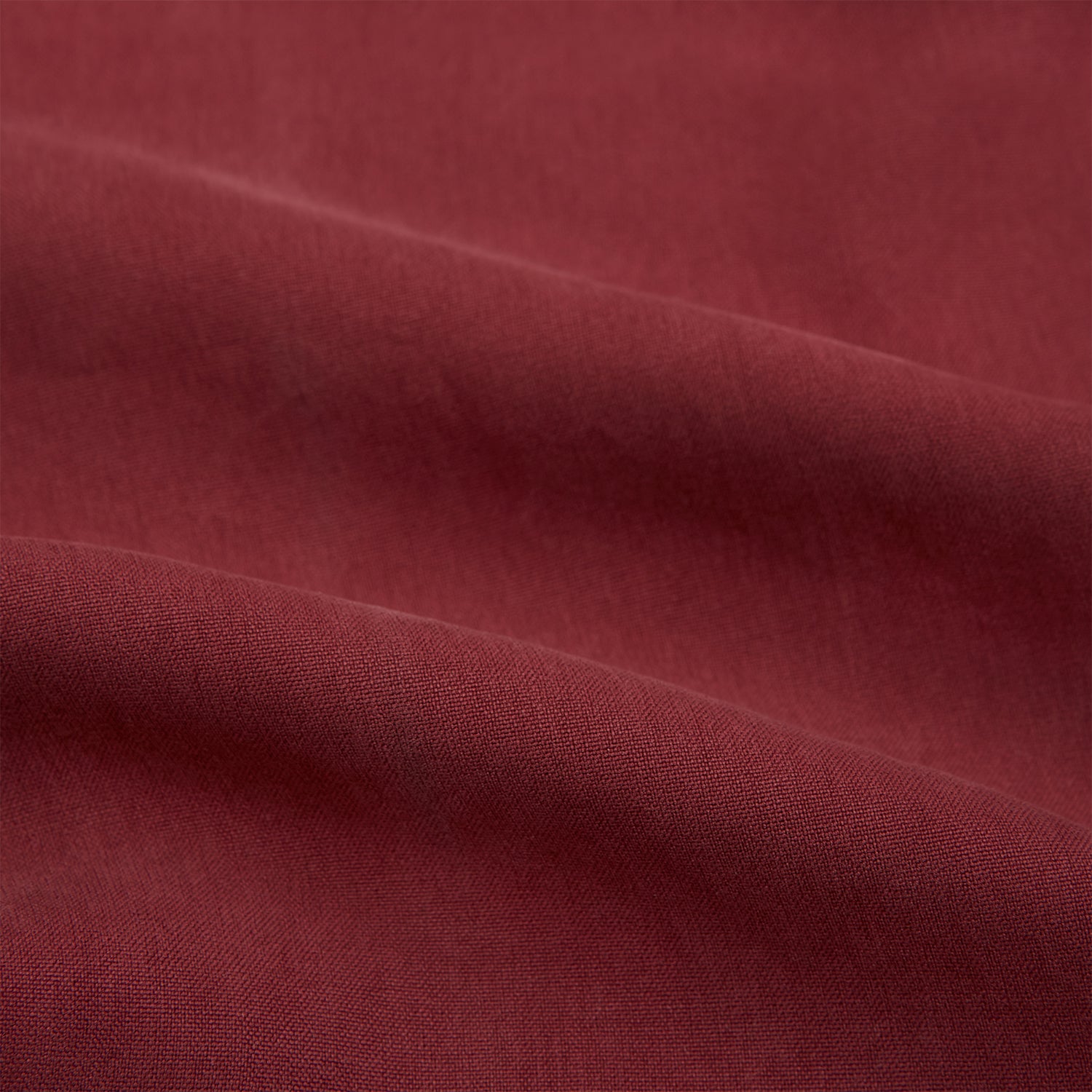 View 6 of product The Turnbull & Asser Burgundy Silk Chelsea Shirt is a long-sleeve, button-up top with a single chest pocket, shown on a white background.