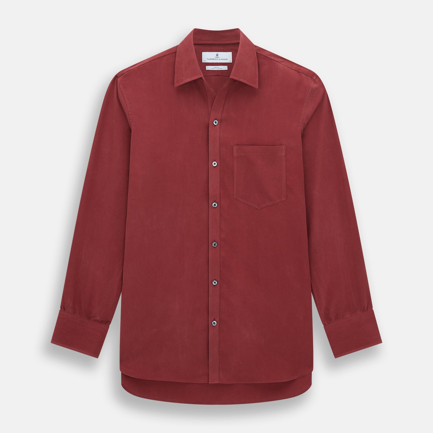View 1 of product The Turnbull & Asser Burgundy Silk Chelsea Shirt is a long-sleeve, button-up top with a single chest pocket, shown on a white background.