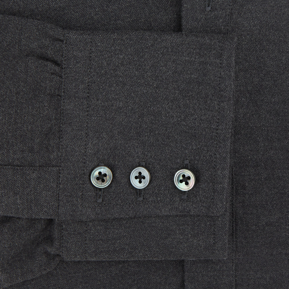 The Charcoal Chelsea Shirt by Turnbull & Asser is a long-sleeve, collared shirt in charcoal gray with a single chest pocket, offering smart-casual style, shown on a plain white background.