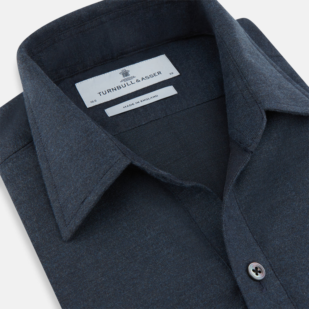 The Navy Chelsea Shirt by Turnbull & Asser is a long-sleeve, button-down flannel with a chest pocket, shown flat on a white background for a classic smart-casual style.