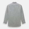 View 5 of product The Turnbull & Asser Grey Herringbone Chelsea Shirt features long sleeves, a chest pocket, classic collar, and buttoned cuffs, adding refined style to smart-casual outfits—shown here against a plain white background.