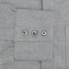 View 3 of product The Turnbull & Asser Grey Herringbone Chelsea Shirt features long sleeves, a chest pocket, classic collar, and buttoned cuffs, adding refined style to smart-casual outfits—shown here against a plain white background.