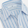 View 2 of product The Turnbull & Asser Blue Multi Track Stripe Chelsea Shirt features long sleeves, a light blue multi-stripe design, a chest pocket, open collar, and buttoned cuffs, shown laid flat on a white background.