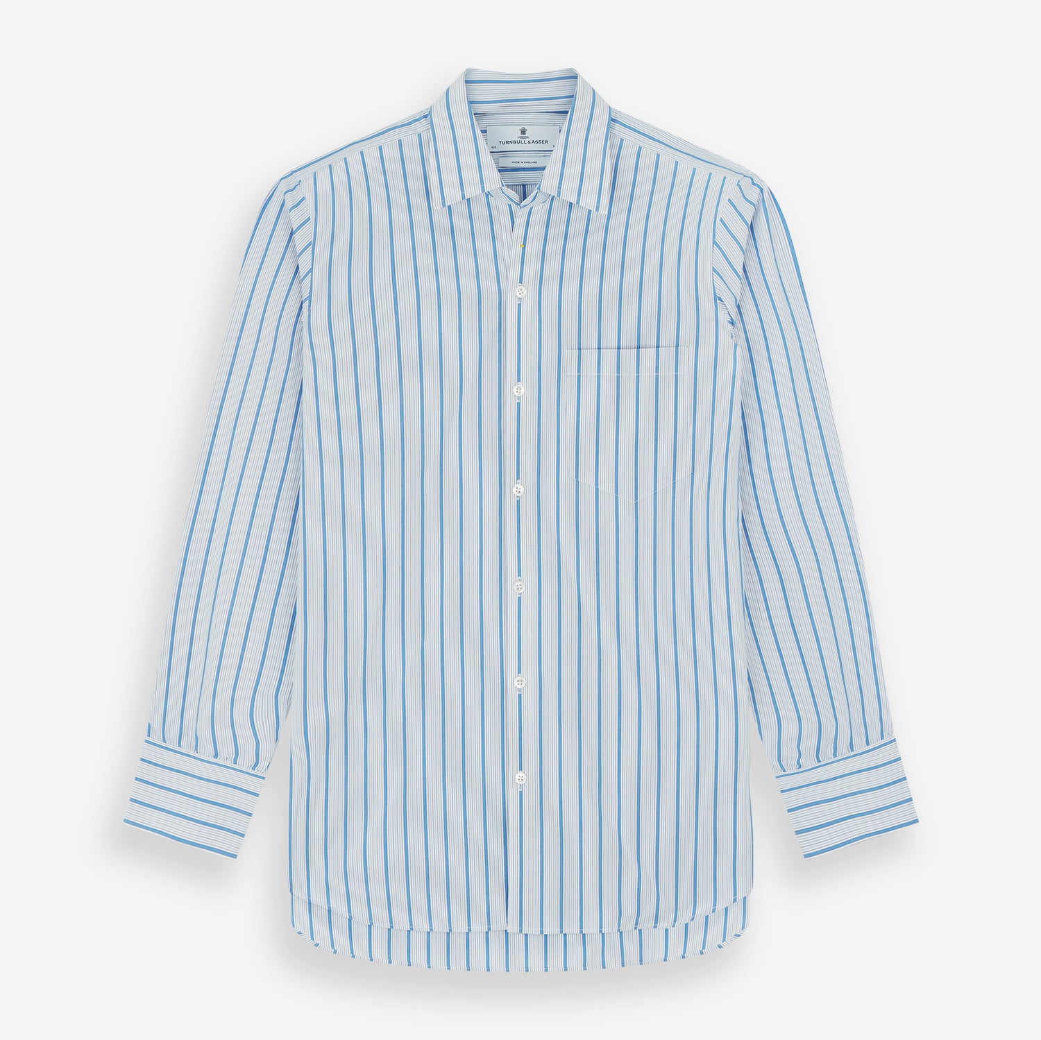 View 1 of product The Turnbull & Asser Blue Multi Track Stripe Chelsea Shirt features long sleeves, a light blue multi-stripe design, a chest pocket, open collar, and buttoned cuffs, shown laid flat on a white background.