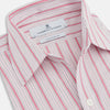 View 2 of product The Turnbull & Asser Pink Multi Track Stripe Chelsea Shirt features long sleeves, an open T&A collar, a left chest pocket, and buttoned cuffs, shown laid flat on a white background.
