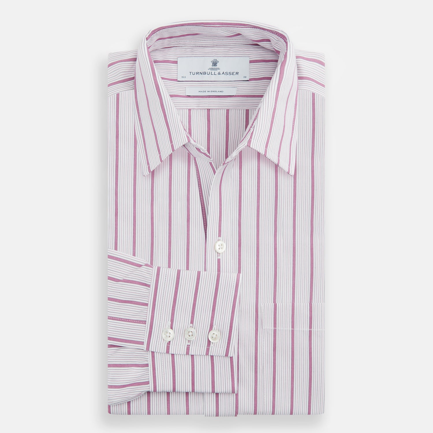 View 5 of product The Purple Multi Track Stripe Chelsea Shirt by Turnbull & Asser features a long-sleeve button-up design with an open Chelsea collar, purple background, vertical multi track stripes, front left pocket, and classic buttoned cuffs.