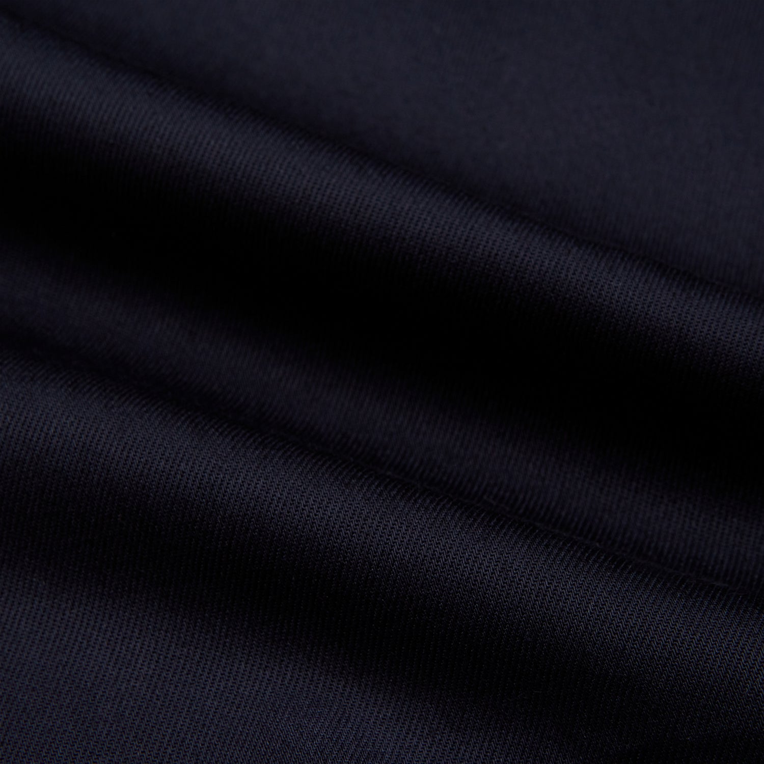 View 6 of product The Turnbull & Asser Navy Twill Chelsea Shirt is a long-sleeve button-up with a collar, front chest pocket, and white buttons, shown against a plain white background.