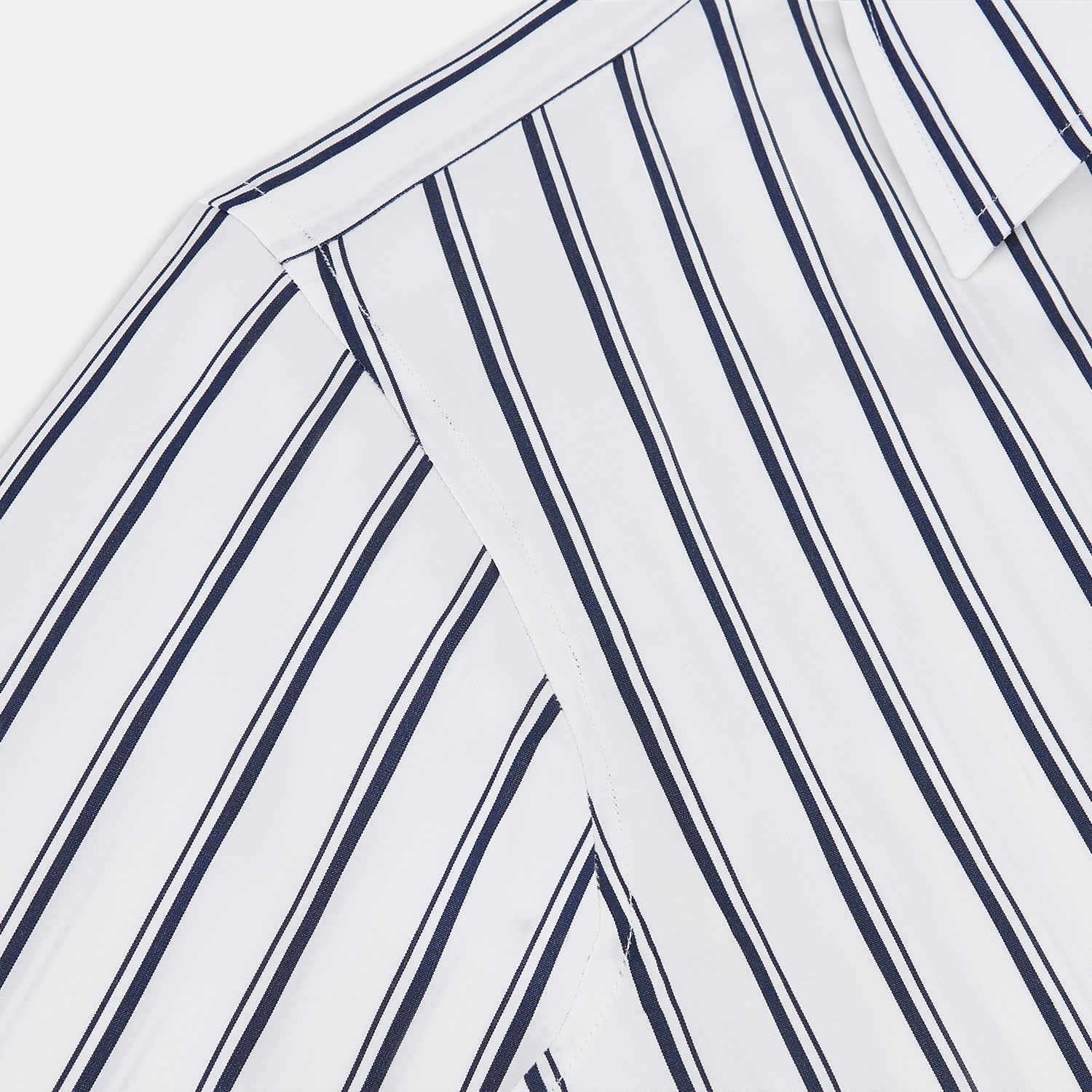 View 6 of product The Turnbull & Asser UK NAVY STRIPED COTTON WESTMINSTER SHIRT features long sleeves, a button-down front, pointed collar, and vertical navy stripes on white for classic British style.