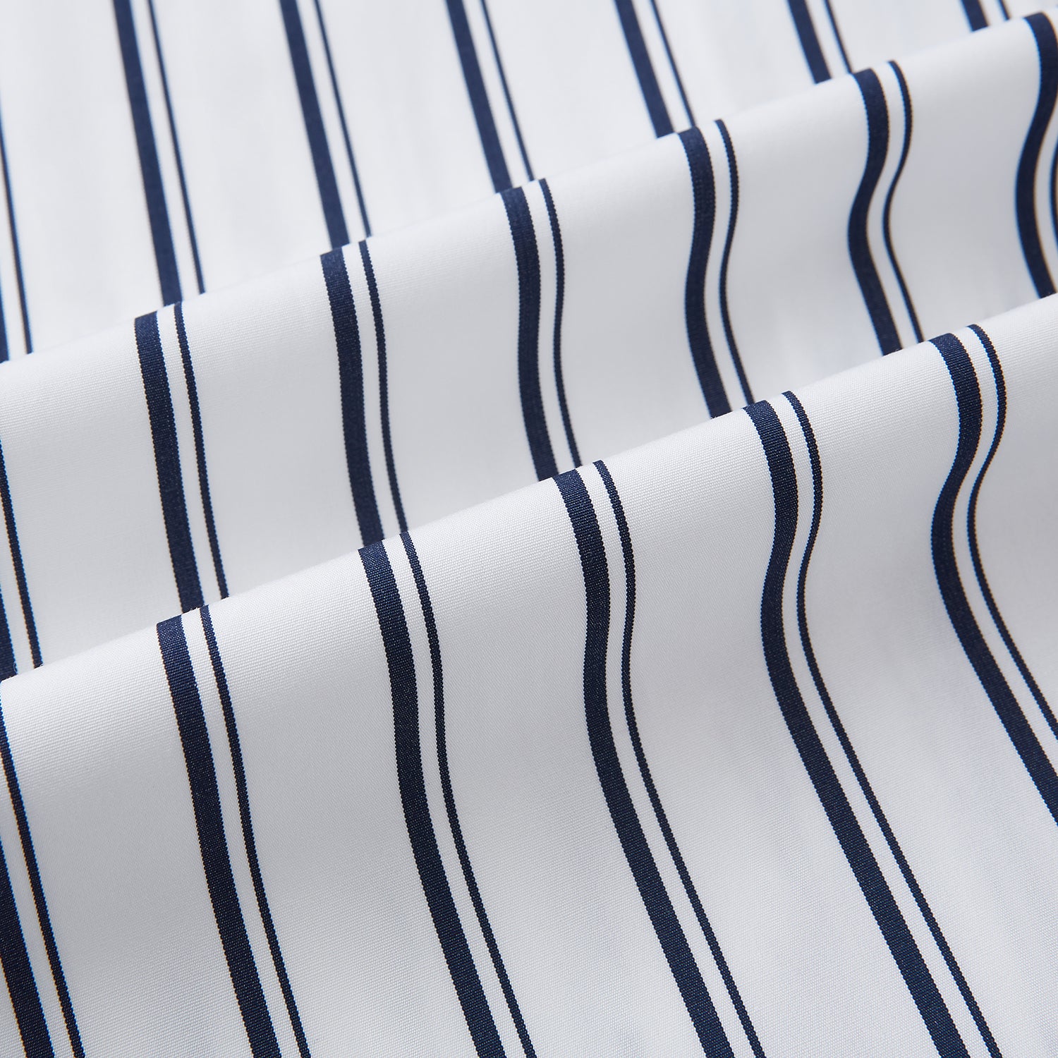 View 8 of product The Turnbull & Asser UK NAVY STRIPED COTTON WESTMINSTER SHIRT features long sleeves, a button-down front, pointed collar, and vertical navy stripes on white for classic British style.