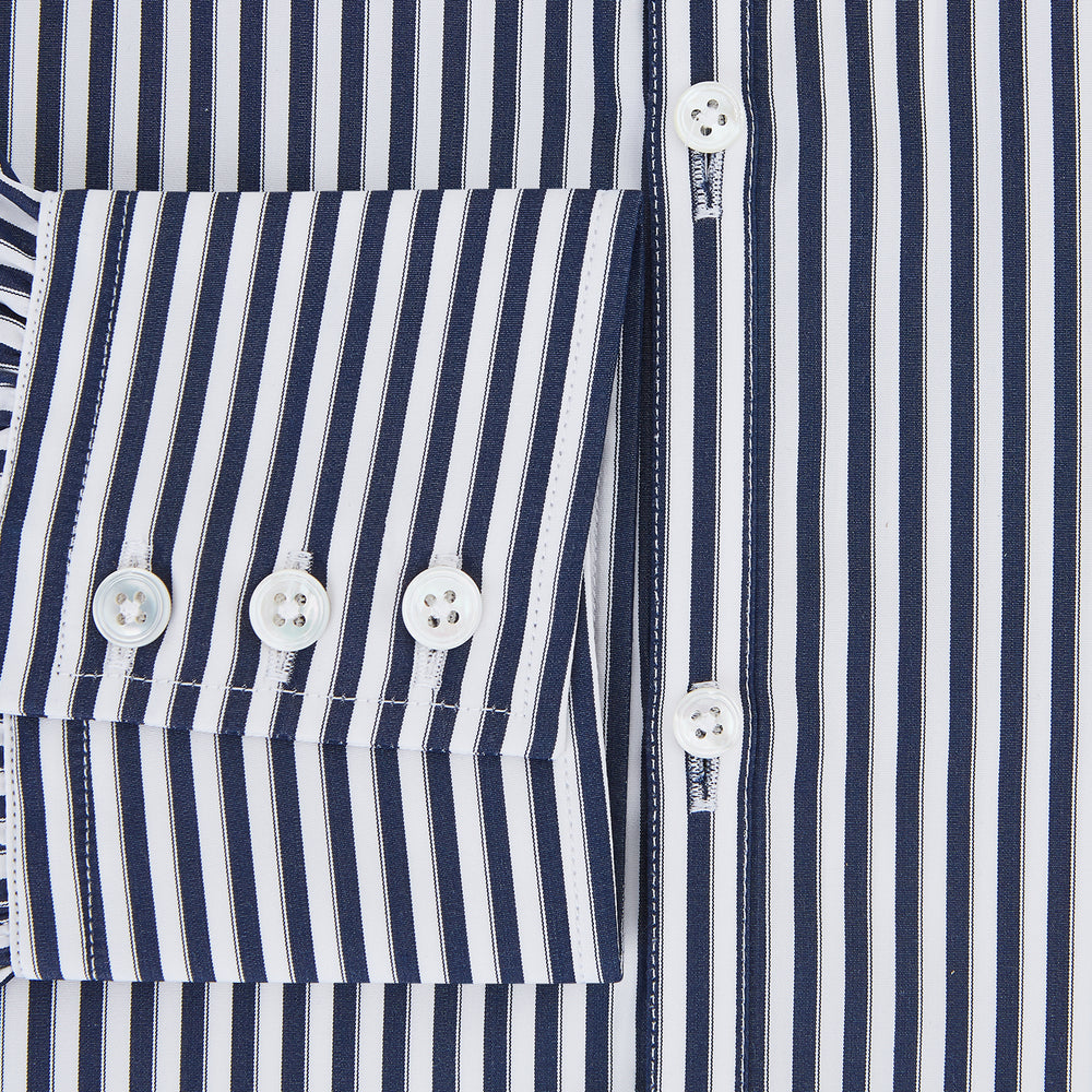 Here is a rewritten version using your product data: A Striped Navy on White Westminster Regular Fit Shirt in Cotton by Turnbull & Asser UK, featuring long sleeves, a button-up front, and a collared neckline with classic vertical stripes. The shirt is neatly laid flat on a white background.