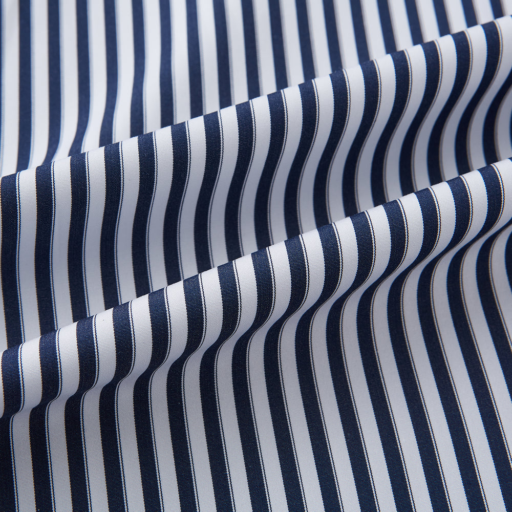 Here is a rewritten version using your product data: A Striped Navy on White Westminster Regular Fit Shirt in Cotton by Turnbull & Asser UK, featuring long sleeves, a button-up front, and a collared neckline with classic vertical stripes. The shirt is neatly laid flat on a white background.