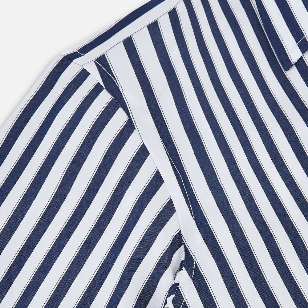 The Striped Navy on White Westminster Regular Fit Shirt in Cotton by Turnbull & Asser UK features vertical navy and white stripes, a classic collar, and buttoned cuffs—a refined example of British shirting, elegantly displayed on a white background.
