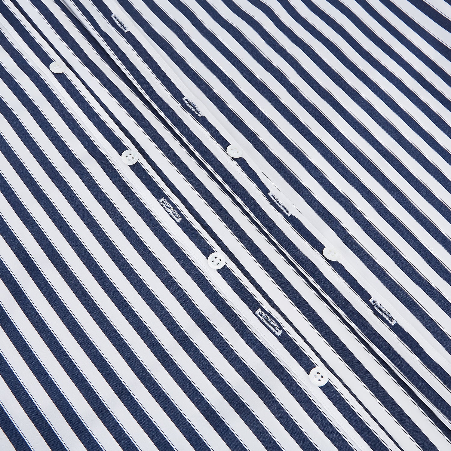 View 6 of product The Striped Navy on White Westminster Regular Fit Shirt in Cotton by Turnbull & Asser UK features vertical navy and white stripes, a classic collar, and buttoned cuffs—a refined example of British shirting, elegantly displayed on a white background.