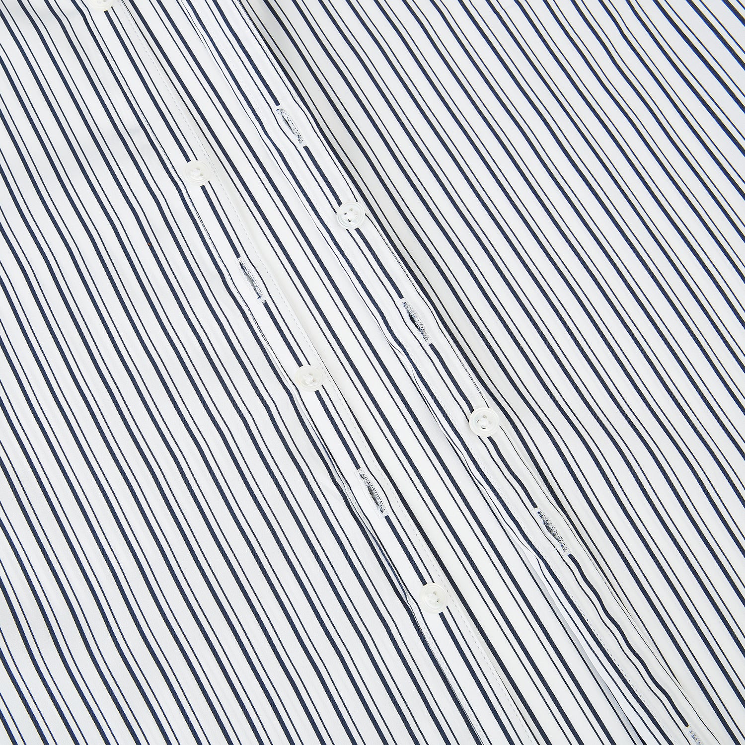 View 7 of product Turnbull & Asser UK Navy Stripe on White Westminster Shirt with a closed collar and button cuffs, laid flat on a white background.