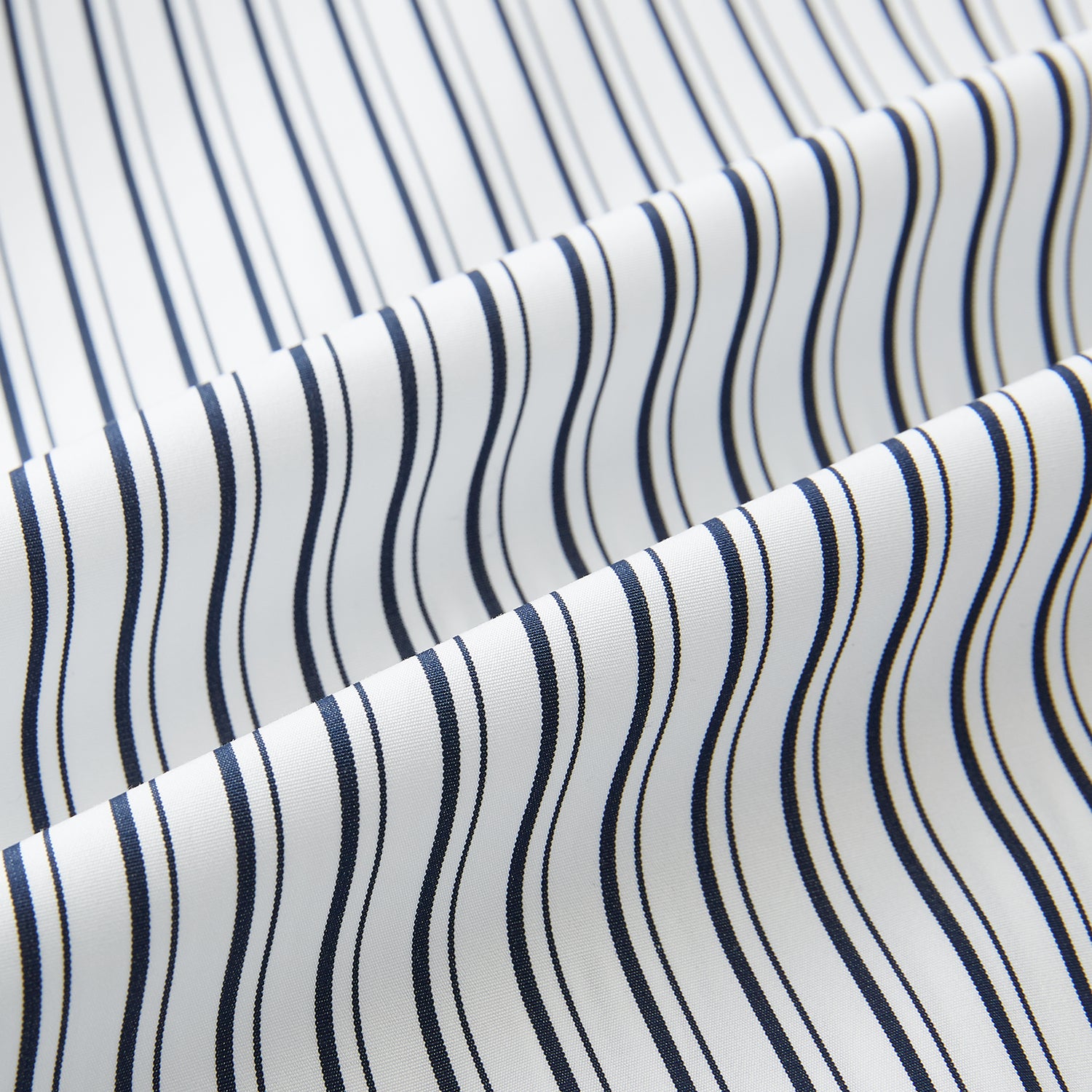 View 8 of product Turnbull & Asser UK Navy Stripe on White Westminster Shirt with a closed collar and button cuffs, laid flat on a white background.