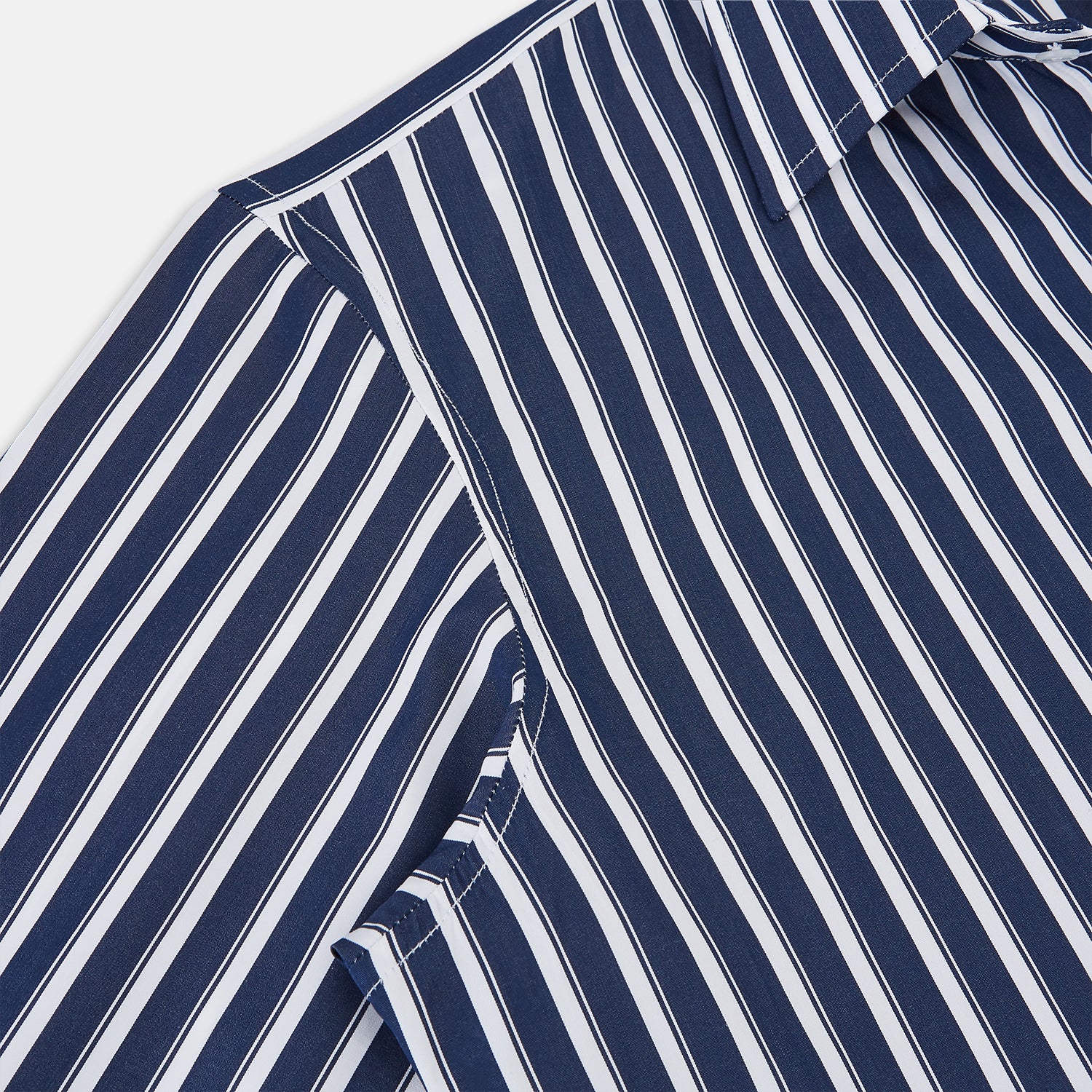 View 3 of product The Turnbull & Asser UK Striped Navy on White Westminster Regular Fit Shirt in Cotton features vertical navy stripes against a white background, with a classic button-up design, long sleeves, and a collar, laid flat on a white surface.