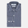 View 2 of product The Turnbull & Asser UK Striped Navy on White Westminster Regular Fit Shirt in Cotton features vertical navy stripes against a white background, with a classic button-up design, long sleeves, and a collar, laid flat on a white surface.