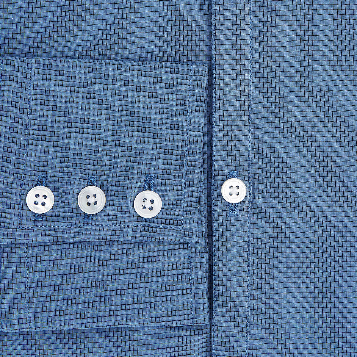 View 4 of product A Colony Blue Pin Check Windsor Shirt by Turnbull & Asser UK, featuring long sleeves, white buttons, a classic Turnbull collar, and buttoned cuffs—expertly crafted in Britain and displayed flat on a white background.