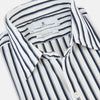 View 2 of product A long-sleeve men’s dress shirt by Turnbull & Asser UK—named SHIRTS RF WINDSOR OPEN CLR BC NAVY STRIPE ON WHTE—featuring classic Windsor open collar styling and navy vertical stripes on a white background, shown on a plain white surface.