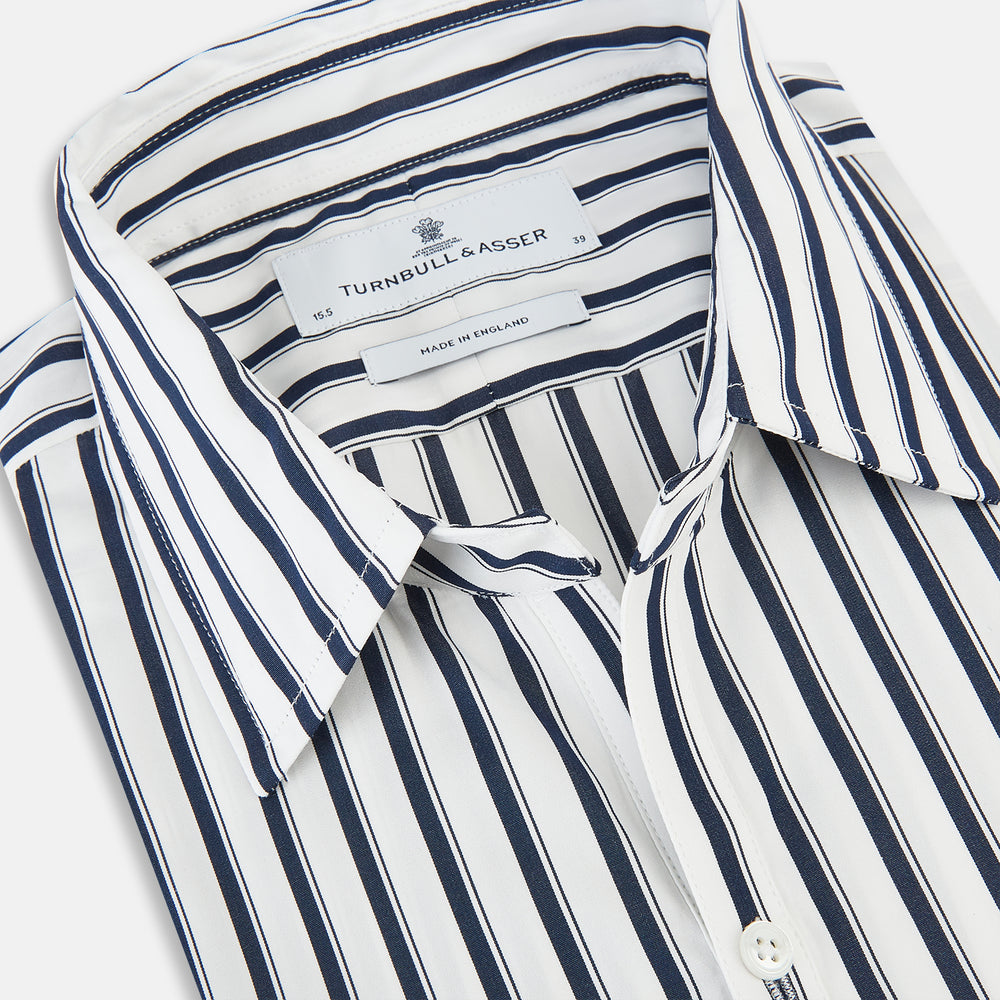 A long-sleeve men’s dress shirt by Turnbull & Asser UK—named SHIRTS RF WINDSOR OPEN CLR BC NAVY STRIPE ON WHTE—featuring classic Windsor open collar styling and navy vertical stripes on a white background, shown on a plain white surface.