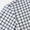 View 5 of product A Chequered Navy on White Windsor Regular Fit Shirt in Cotton by Turnbull & Asser UK, featuring long sleeves, a classic collar, buttoned cuffs, and a navy and white windowpane check pattern, displayed on a white background.