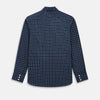 View 3 of product The Turnbull & Asser UK White Check on Navy Windsor Shirt features an open collar, button cuffs, and cuffed long sleeves. Showcased against a white background, this shirt presents a navy base adorned with a white grid pattern.