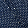 View 7 of product The Turnbull & Asser UK White Check on Navy Windsor Shirt features an open collar, button cuffs, and cuffed long sleeves. Showcased against a white background, this shirt presents a navy base adorned with a white grid pattern.