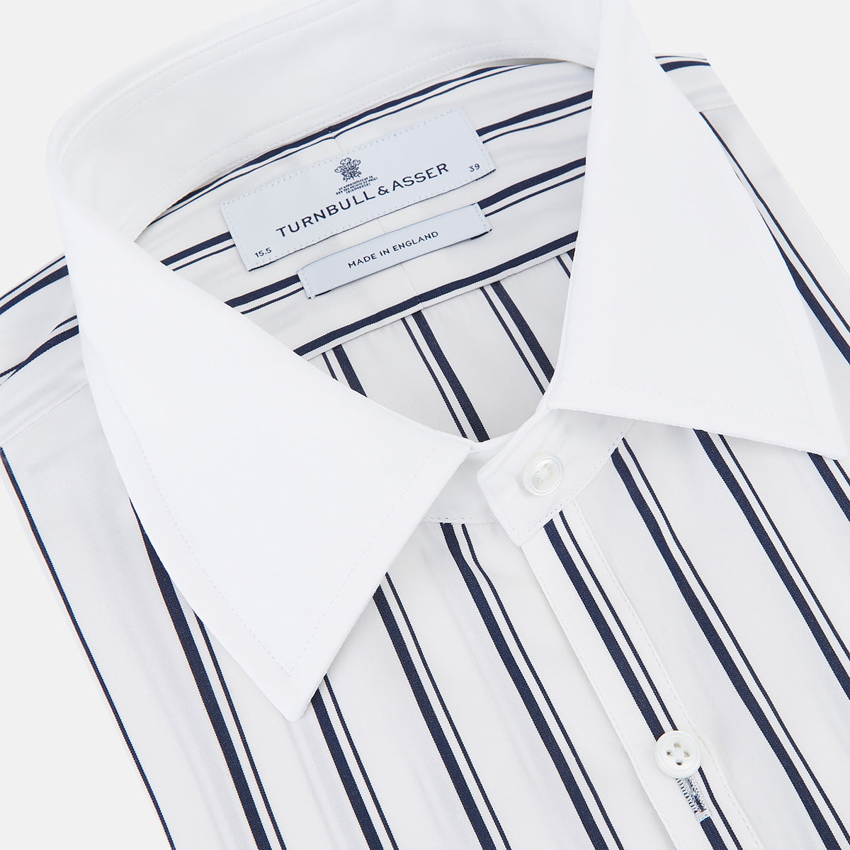 View 2 of product Turnbull & Asser Westminster Double Stripe White Closed Collar Regular Fit Shirt in Cotton featuring a vertical black double-stripe pattern on a white background with a white collar and cuffs.