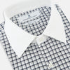 View 2 of product Turnbull & Asser UK Westminster Double-Track Check Navy Closed Collar Regular Fit Shirt in Cotton featuring a long-sleeve button-up design in a navy and white check pattern, complete with a white collar and white cuffs.