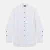 View 11 of product The Casino Royale White Dress Shirt in Cotton by Turnbull & Asser UK is a long-sleeve white dress shirt, crafted from crisp white cotton poplin with a pleated bib front, black buttons, and a classic collar, shown laid flat on a white background.