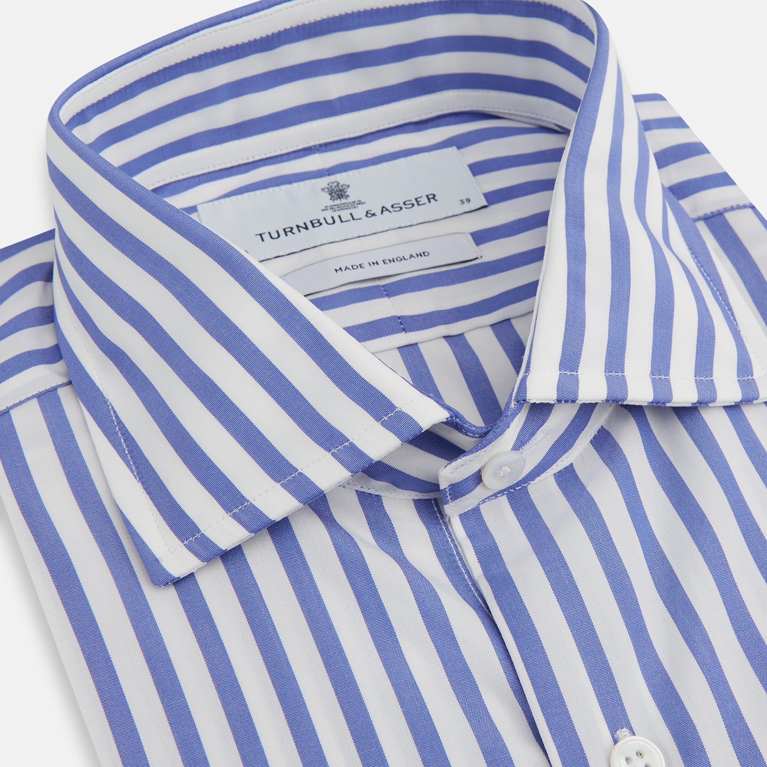 View 3 of product A Tailored Fit Blue and White Candy Stripe Shirt with Kent collar and 3-button cuffs by Turnbull & Asser, featuring the brand's label inside the collar.