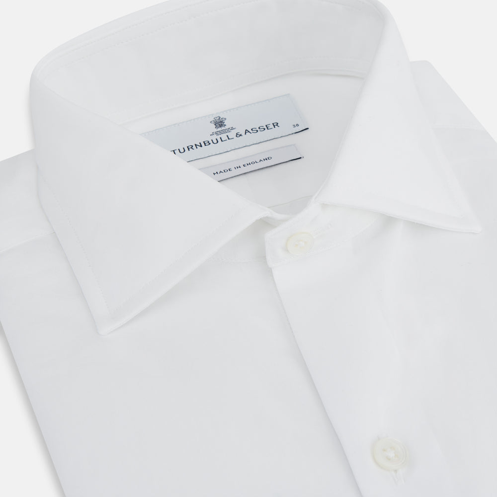 Turnbull & Asser's Tailored Fit Plain White Cotton Shirt features a Kent collar and double cuffs, shown on a white background.