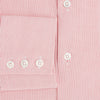 View 4 of product The Turnbull & Asser UK CORAL COTTON MINI CHECKED SHIRT is a light pink long-sleeve button-up shirt with a Kent collar, white buttons, and three-button cuffs, shown on a plain white background.