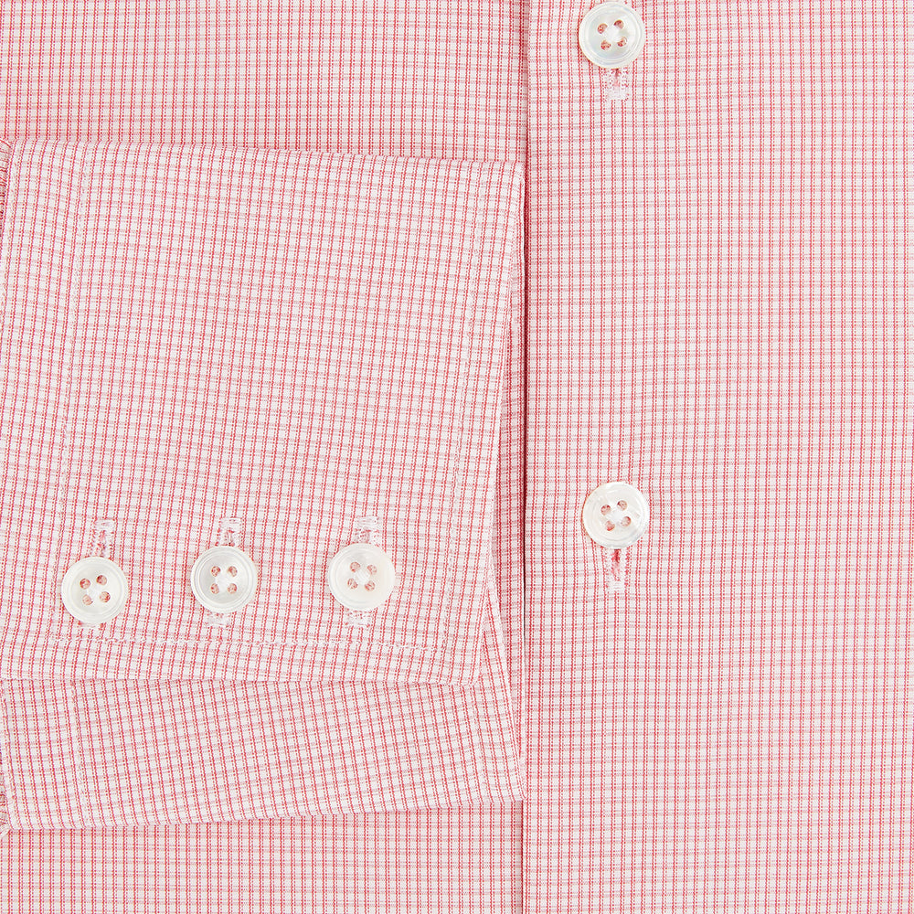 The Turnbull & Asser UK CORAL COTTON MINI CHECKED SHIRT is a light pink long-sleeve button-up shirt with a Kent collar, white buttons, and three-button cuffs, shown on a plain white background.