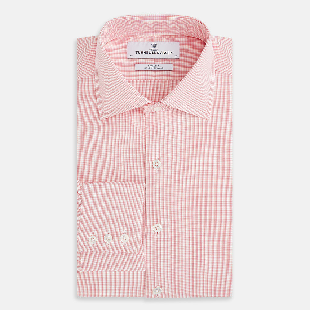 The Turnbull & Asser UK CORAL COTTON MINI CHECKED SHIRT is a light pink long-sleeve button-up shirt with a Kent collar, white buttons, and three-button cuffs, shown on a plain white background.