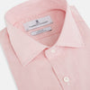 View 2 of product The Fine Striped Coral on White Tailored Fit Shirt in Cotton by Turnbull & Asser UK is a light pink long-sleeve button-up dress shirt with a collar, featuring subtle coral stripe detailing, displayed flat against a white background.