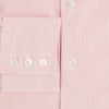 View 3 of product The Fine Striped Coral on White Tailored Fit Shirt in Cotton by Turnbull & Asser UK is a light pink long-sleeve button-up dress shirt with a collar, featuring subtle coral stripe detailing, displayed flat against a white background.