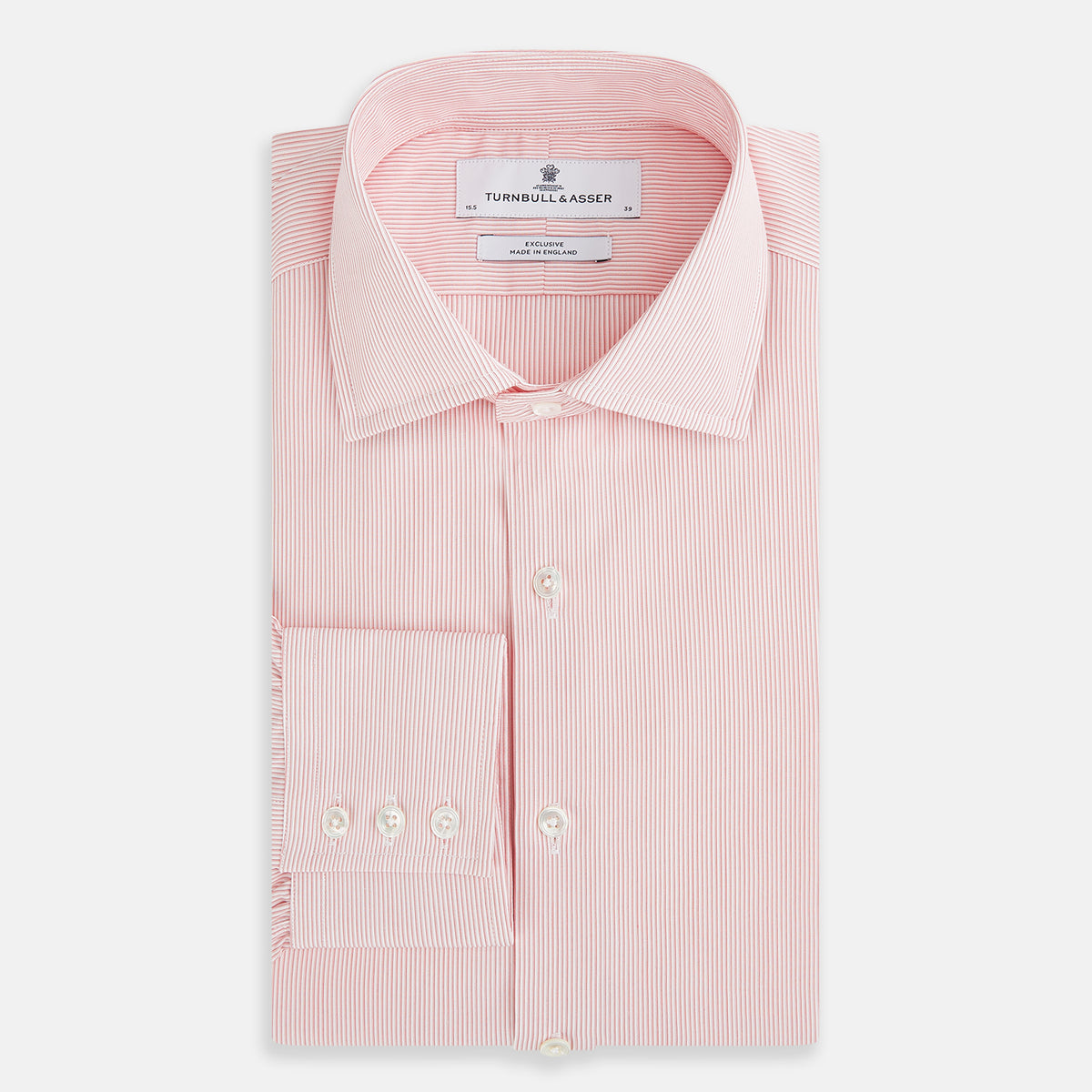 View 4 of product The Fine Striped Coral on White Tailored Fit Shirt in Cotton by Turnbull & Asser UK is a light pink long-sleeve button-up dress shirt with a collar, featuring subtle coral stripe detailing, displayed flat against a white background.