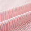 View 5 of product The Fine Striped Coral on White Tailored Fit Shirt in Cotton by Turnbull & Asser UK is a light pink long-sleeve button-up dress shirt with a collar, featuring subtle coral stripe detailing, displayed flat against a white background.