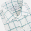 View 2 of product The Turnbull & Asser UK Large Checked Sage on White Tailored Fit Shirt in Cotton features white, long sleeves and button-up styling with a subtle sage check and light gray windowpane plaid pattern, neatly laid flat against a white background.
