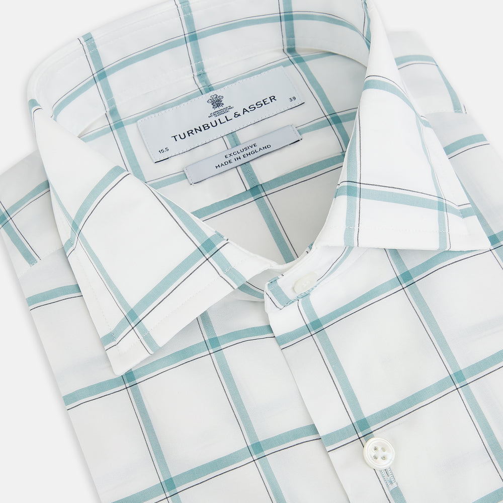 The Turnbull & Asser UK Large Checked Sage on White Tailored Fit Shirt in Cotton features white, long sleeves and button-up styling with a subtle sage check and light gray windowpane plaid pattern, neatly laid flat against a white background.