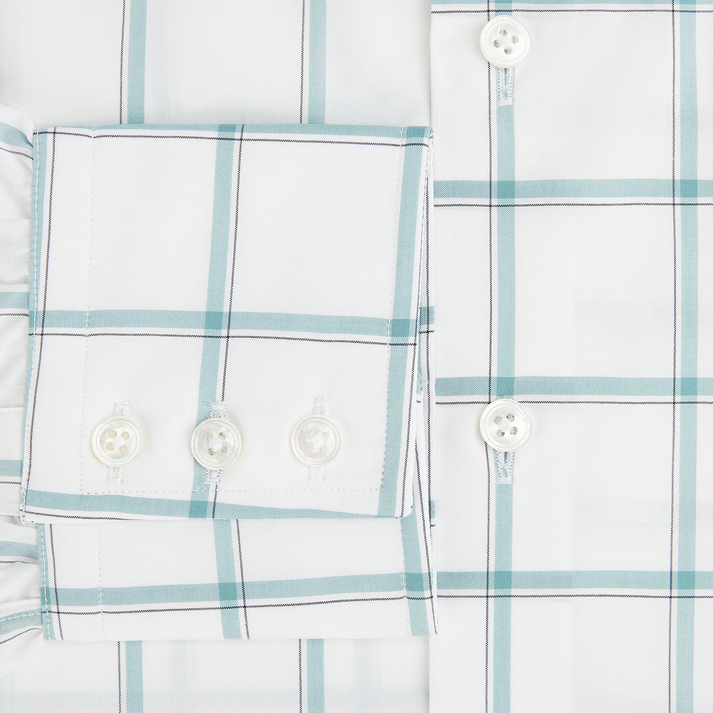 The Turnbull & Asser UK Large Checked Sage on White Tailored Fit Shirt in Cotton features white, long sleeves and button-up styling with a subtle sage check and light gray windowpane plaid pattern, neatly laid flat against a white background.